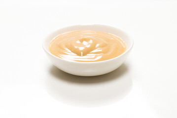Mushroom sauce in a bowl isolated on white background.