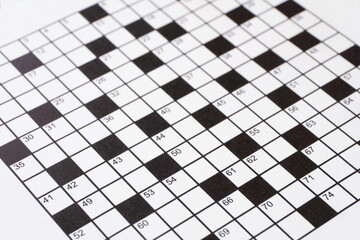 Black and white crossword in a newspaper or magazine. Narrow depth of field