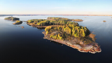 Autumn in Vyborg bay, aero view of clean nordic nature. Beautiful rocks and cliffs with woods in North Europe, Baltic sea, gulf of Finland.