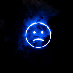 Stylized face expressing emotion glows through the stream of smoke in the dark