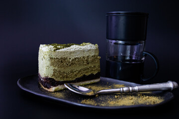 Close up Green tea Cake on Black Plate