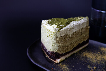 Close up Green tea Cake on Black Plate