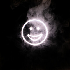 Stylized face expressing emotion glows through the stream of smoke in the dark