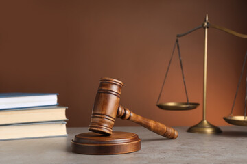 Wooden gavel on grey table. Law concept