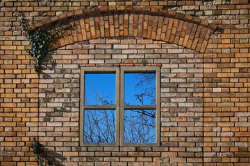 Abandoned Building Window shows blue Sky