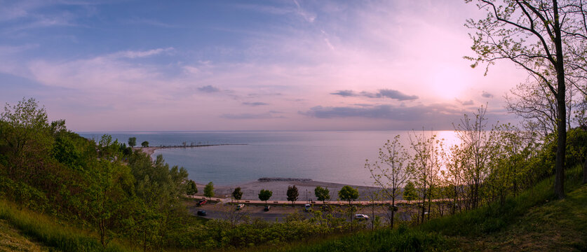 The sun sets over Lake Huron in this panoramic as seen from Bingham Butterfly Park in Goderich, Ontario.
