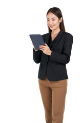 Naklejka premium Young asian businesswoman with a smile in a black suit typing on a tablet computer. Portrait on white background with studio light.