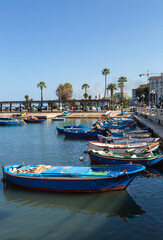 Fototapeta na wymiar City promenade with sea view and boats.