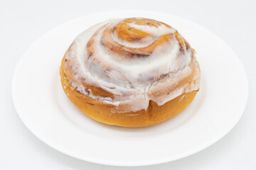 Delicious Homemade Cinnamon Roll on a White Plate