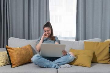 Young woman on the verge of tears is sitting alone and looking happy and reading a medical report...