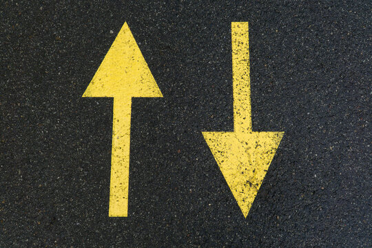 Yellow Road Markings On Wet Asphalt