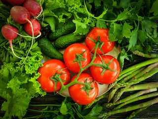 fresh organic vegetables on a wooden background