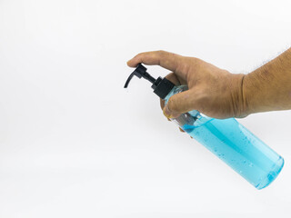 Man's hand holds a clear plastic bottle containing gel inside. The top of the bottle is a pump head, containing clear blue alcohol Take a picture on a white background