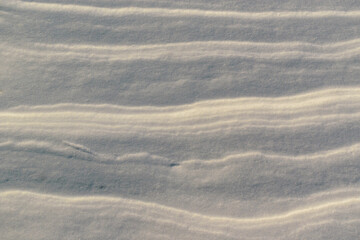 Compacted layers of snow. Shine. Layered background concept.