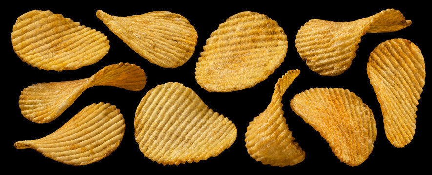 Ridged potato chips on black background, collection