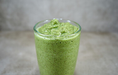 Green vegetable smoothie in the galss