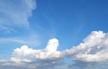 Blue sky background with white clouds on natural daylight