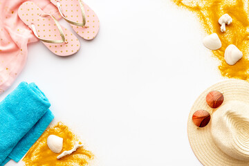 Flat lay of summer beach accessories isolated on white. Sraw hat with sunglasses and flip flops