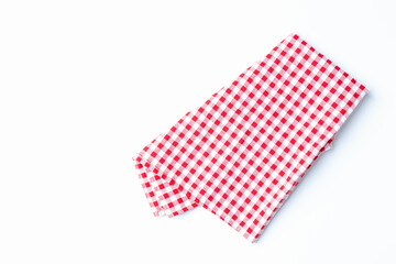 Top view napkin checkers red and white place on a white background. Fabric red and white Isolated with copy space.