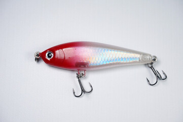 Plastic fishing lure on a white background. Home made fishing lure.   