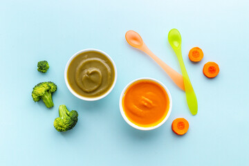 Set of bowls with baby food with fruits and vegetables. Kid feeding, top view