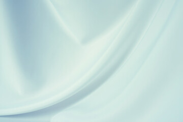 Elegant light blue silk or satin texture can use as abstract background. Luxurious background design