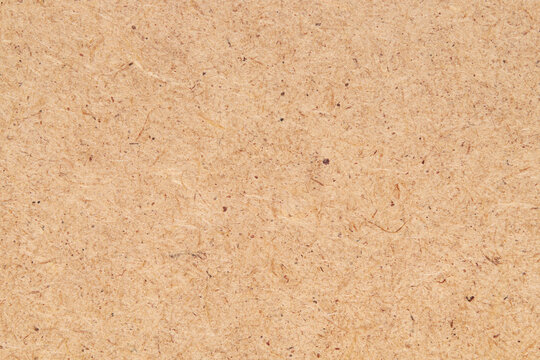 Fiberboard or fibreboard, wood chippings board as background. HDF wood panel.