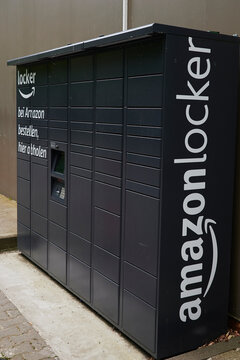 Berlin, Germany - May 21, 2021: Black Amazon lockers for parcels of customers.