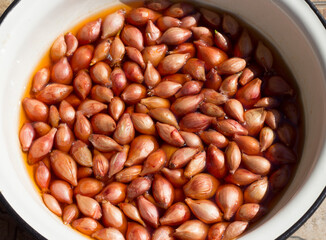 small onion heads in water