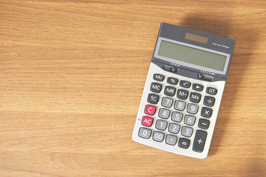 calculator on the wood table