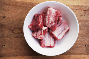 raw pork rib in a white small bow prepare cooking