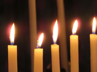 Beautiful photo of candles in a church lit for the feeling