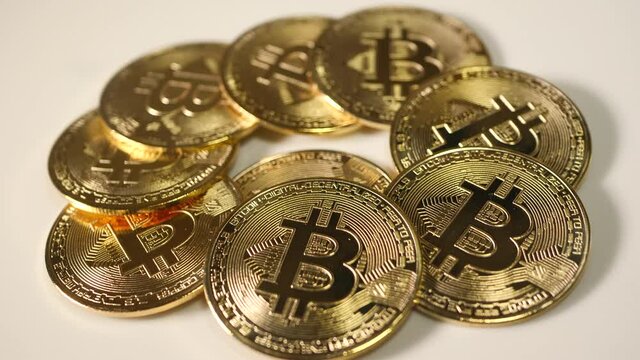 Golden bitcoins, circle of goldplated coins. Close up.