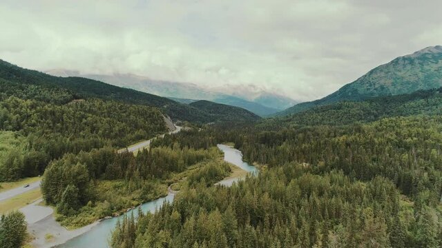 Aerial view over a river through a valley