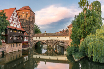 A colourful and picturesque view of the half-timbered old houses on the banks of the Pegnitz river in Nuremberg. A Tourist attractions in Bavaria and Germany