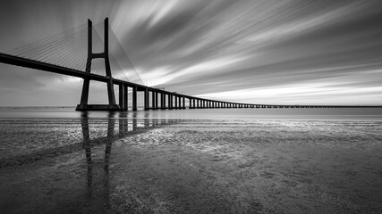 Black and white bridge over the river, Lisbon.
