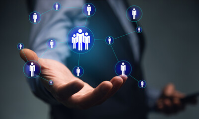 man holding phone with  people icon