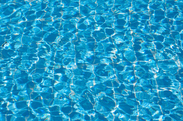 Shining blue water ripple background. sun reflection background ripple water. swimming pool water. surface of blue swimming pool background of water in swimming pool