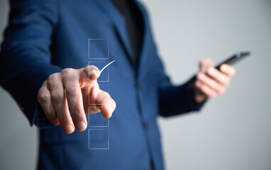 man holding phone with accepted icon