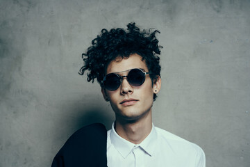 emotional guy with curly hair teen classic suit sunglasses shirt model