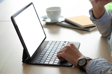 Businesswoman hand working with digital tablet with stylus pen on worktable