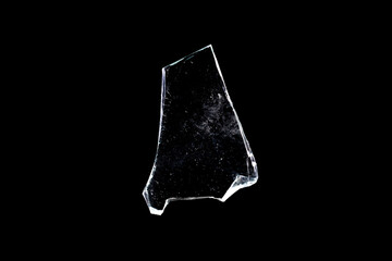 broken glass. piece of window isolated on a black background