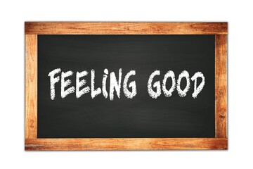 Obraz premium FEELING GOOD text written on wooden frame school blackboard.