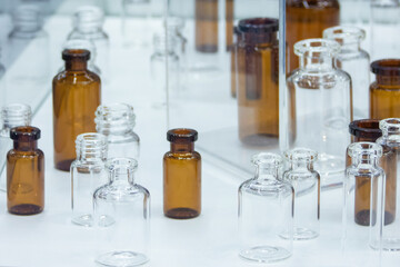 Group of empty medicine glass bottles, low-grip
