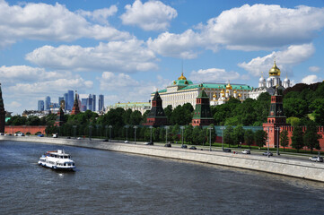 Panoramic view of the Moscow Kremlin. Moscow river and pleasure boat. Moscow, Russia May 22, 2021