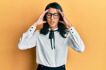 Beautiful asian young woman wearing business shirt with hand on head, headache because stress....