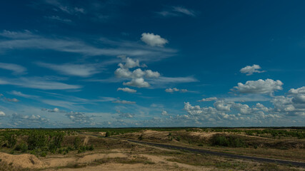 asphalt old road in the sand dunes, panoramic landscape.