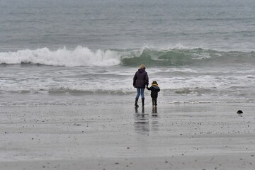 People walking on a beach in Brittany