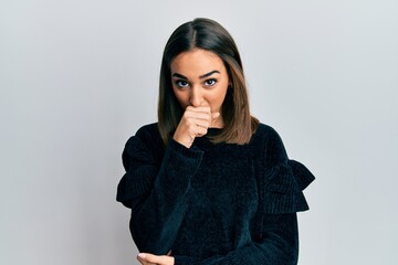 Young brunette girl wearing elegant fashion sweater feeling unwell and coughing as symptom for cold...
