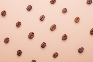 many coffee beans isolated on brown background flat lay pattern